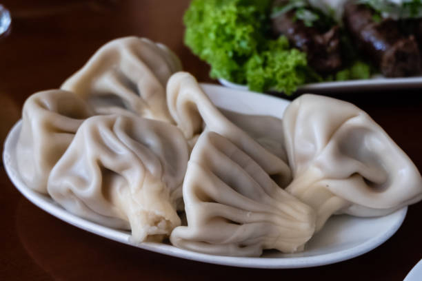 istock Georgian traditional Khinkali with meat on plate 1215744672