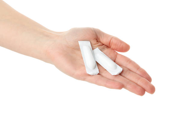istock Hand with anal or vaginal candles, isolated on white background 1215744806