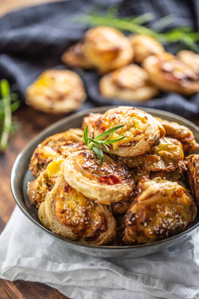 istock Pizza rolls stuffed with various ingredients, prosciutto bacon spinach basil mozzarella or parmesan cheese. 1215745325