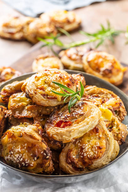 istock Pizza rolls stuffed with various ingredients, prosciutto bacon spinach basil mozzarella or parmesan cheese. 1215745334