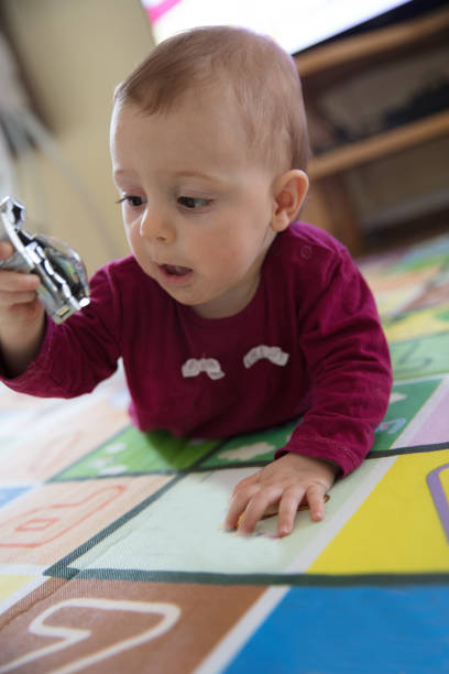istock Baby girl crawling 1215746488