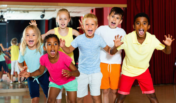 istock Happy emotional children posing at modern dance class 1215746812