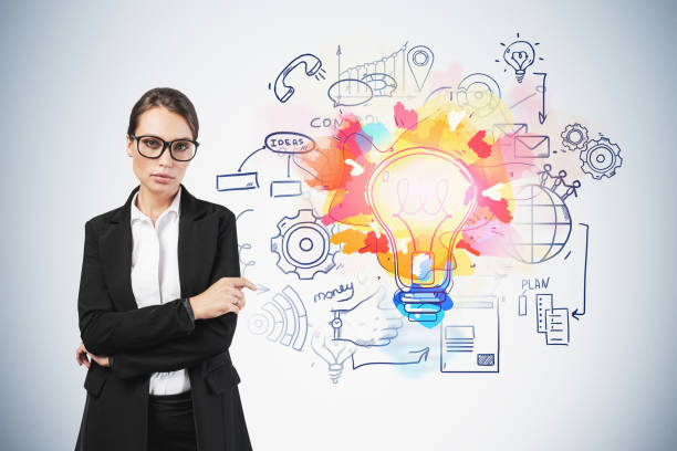 istock Confident woman and her bright business idea 1215746999