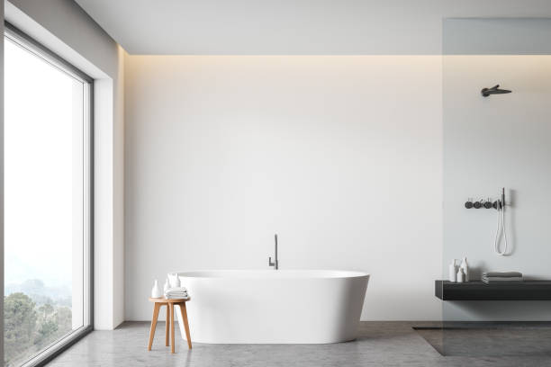 istock White bathroom interior with tub and shower 1215748606