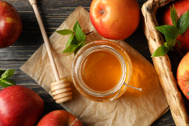 istock Apples and honey on wooden background, top view 1215748924