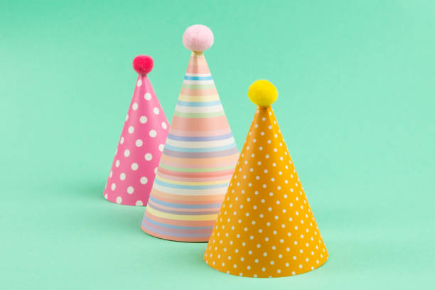 istock Colorful birthday caps on mint background. 1215749819