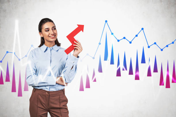 istock Smiling businesswoman and growing graph 1215749833
