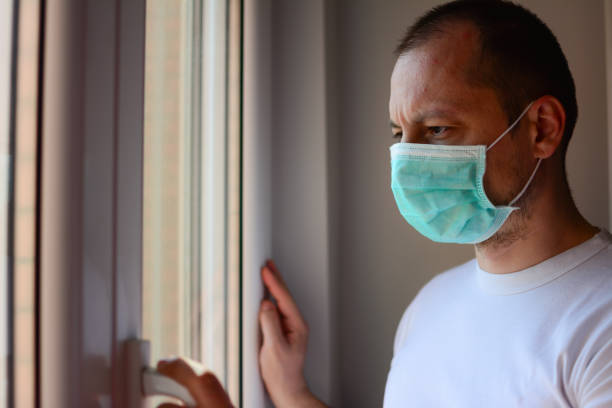 istock Horizontal background man in isolation at home for virus outbreak or hypochondria 1215749879