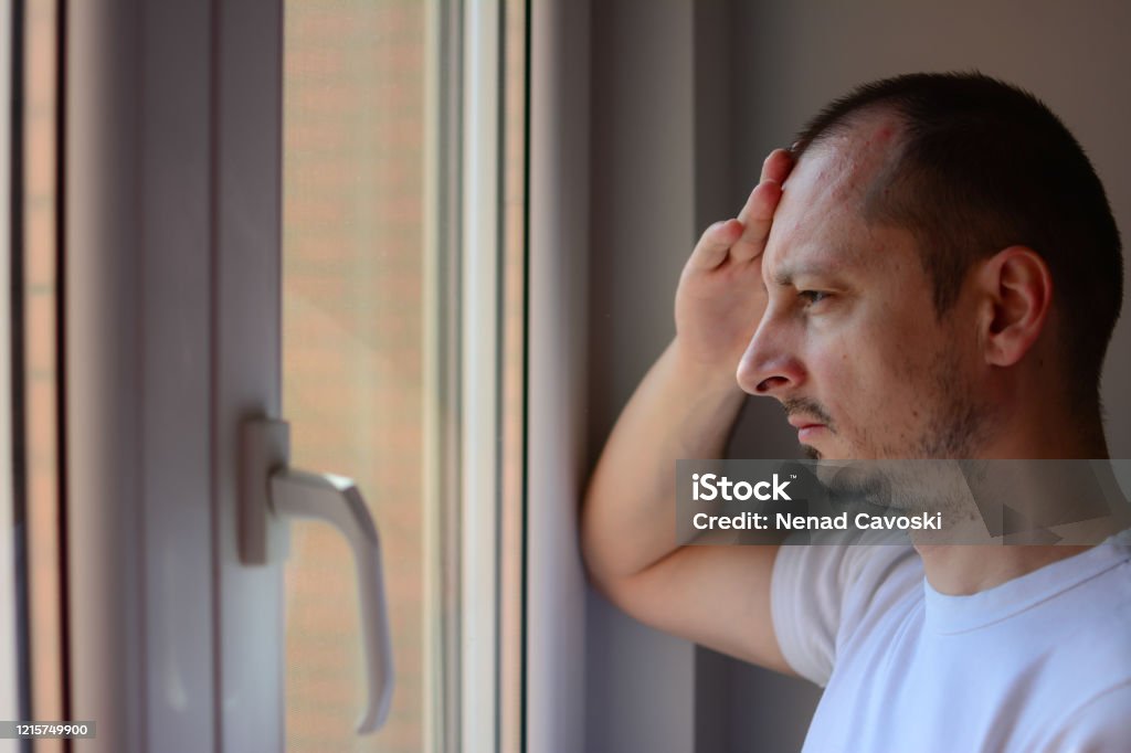 A Man Looking Out Window Stock Photo - Download Image Now - Men, Sadness,  Looking Through Window - iStock