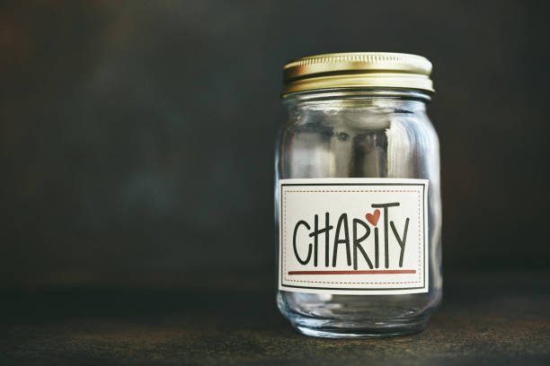 자선 및 기부 테마. 모금 개념, 빈 항아리 - jar currency donation box charity and relief work 뉴스 사진 이미지