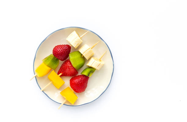 istock Healthy assorted fruit skewers from above 1215750953