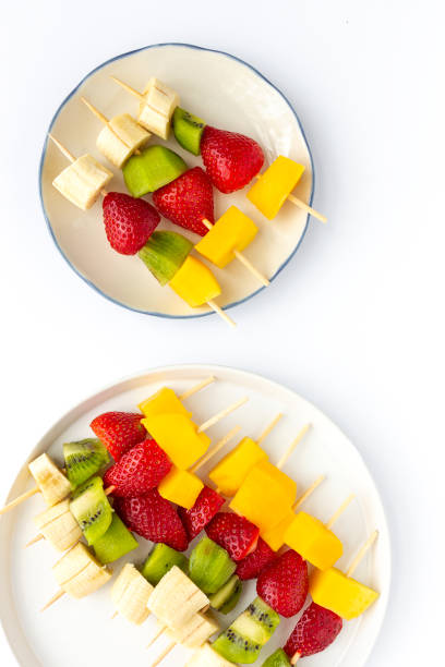 istock Healthy assorted fruit skewers from above 1215751445