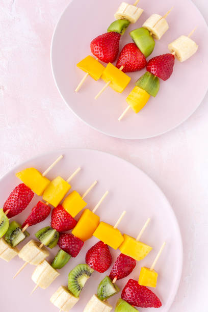 istock Healthy assorted fruit skewers from above 1215751545
