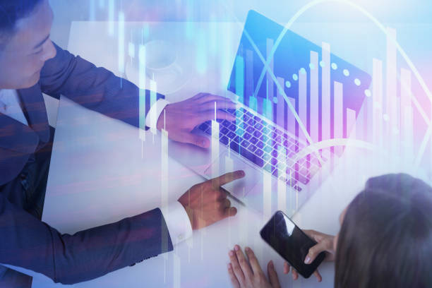 istock Business partners in office, digital graph 1215751751