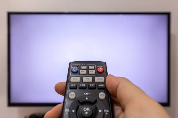 istock Changing the channels on a TV concept 1215751752