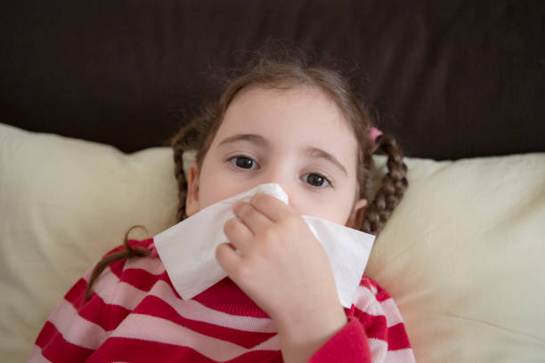 istock Little Girl Cleaning Her Nose 1215754061