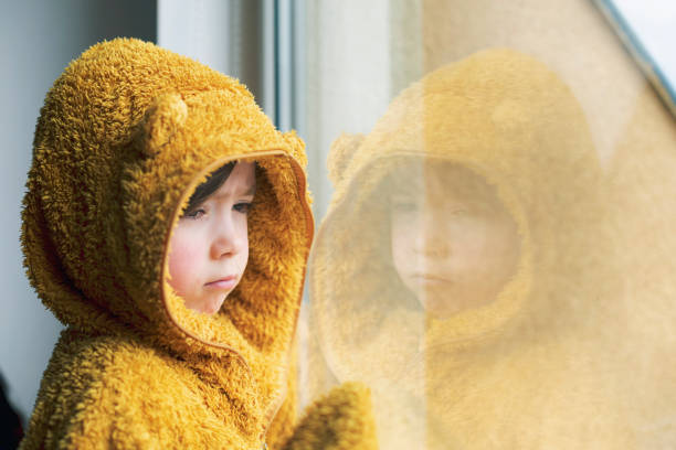 istock Sad child in isolation at home 1215754553