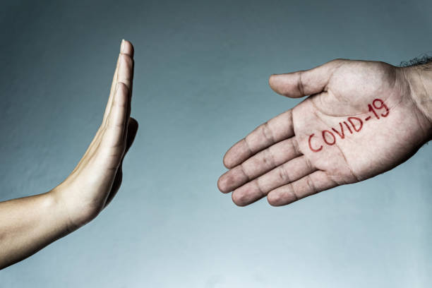 istock Coronavirus transmission concept with a handshake. Covid-19, Coronavirus, SARS-CoV-2 outbreak. 2019 - 2020 Novel Coronavirus background. Stay home. 1215755568