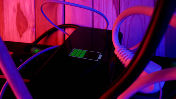 istock Smart phone charging among power cords 1215755737