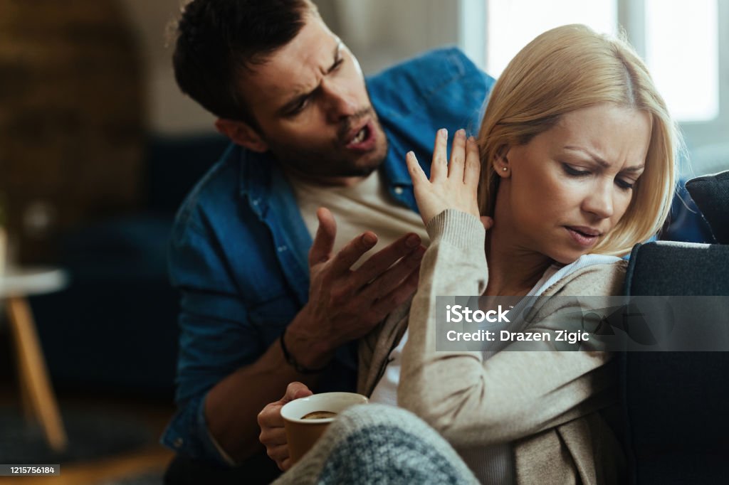 Leave me alone, please! Young couple with relationship difficulties arguing about their problems at home. Couple - Relationship Stock Photo