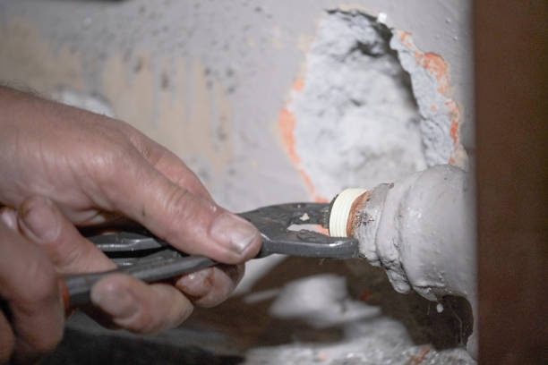 istock Worker fixing the pipes with Adjustable Wrench 1215757711