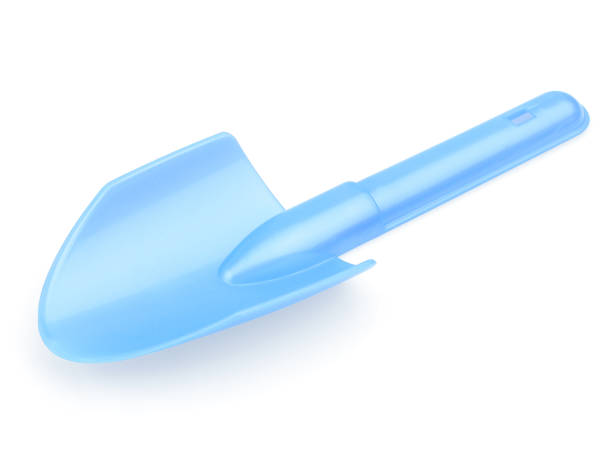 istock Children's blue shoulder blade. A shovel for playing with sand. Shoulder blade on a white background. The concept of the construction 1215758427