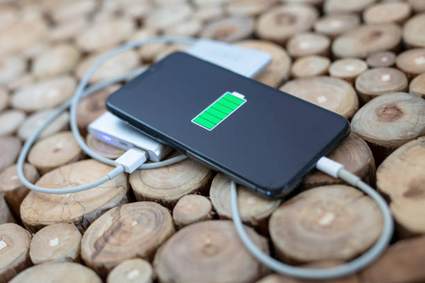 Still life smart phone on power bank on wood table