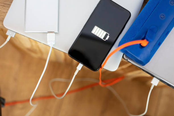 istock Smart phone and technology devices plugged in and charging 1215758718