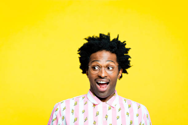istock Shocked hipster, portrait on yellow background 1215758820