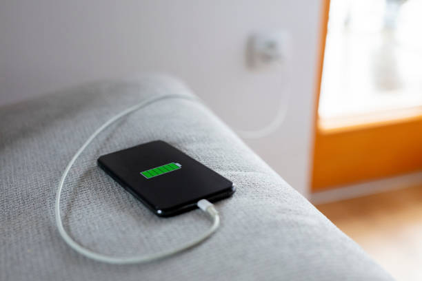 istock Smart phone charging,plugged into electrical outlet 1215759492