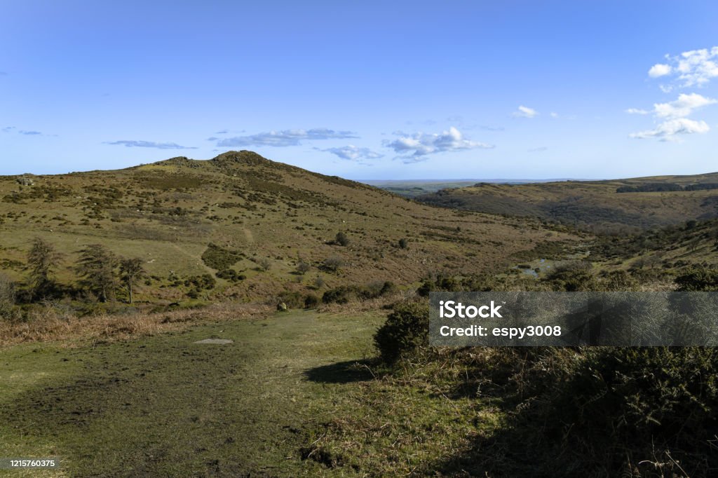 Sharp Tor A bracketed landscape image of Sharp Tor near Dartmeet on a lovely spring afternoon, Dartmoor National Park, Devon, England. Dartmoor Stock Photo