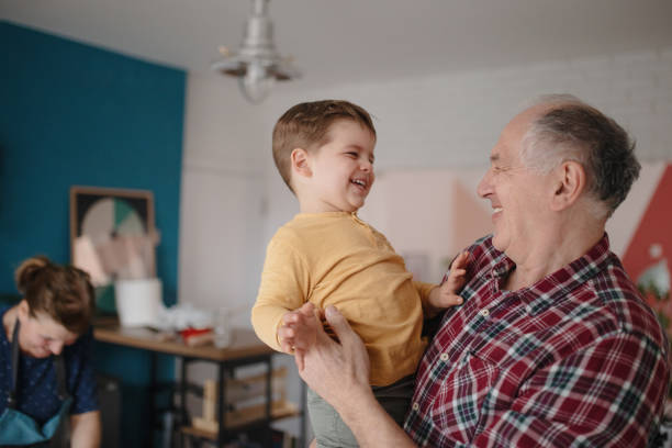 istock Grandfather embracing grandson and smiling 1215760421