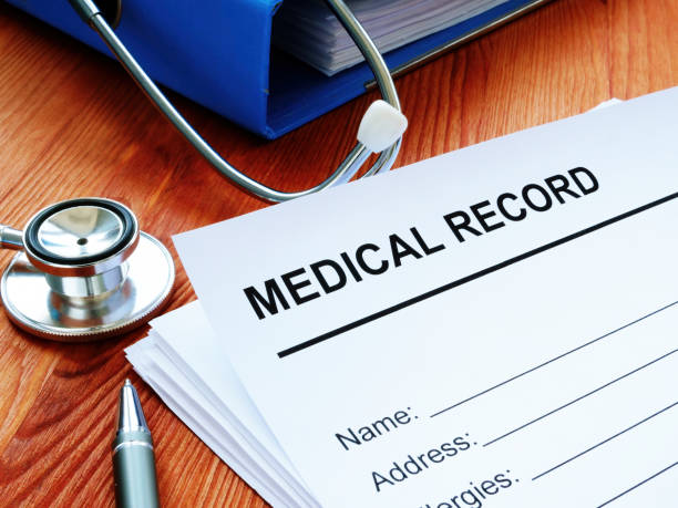 istock Medical record and stack of papers with stethoscope. 1215761308