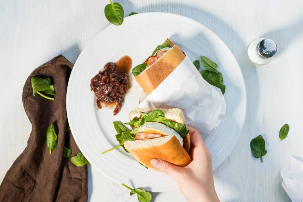 istock Ciabatta sandwich with fresh goat cheese, bacon and spinach from above. 1215764666