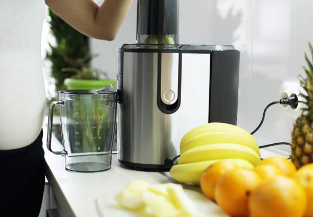 istock Pregnant woman at kitchen 1215765200