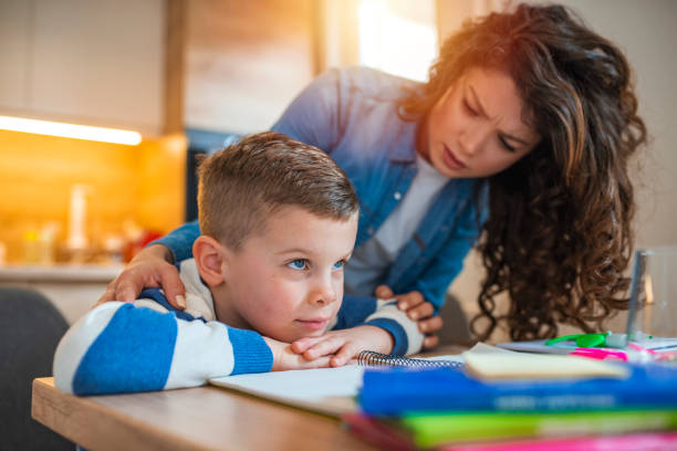 istock Mother Becoming Frustrated With Son Whilst Doing Homework 1215765269