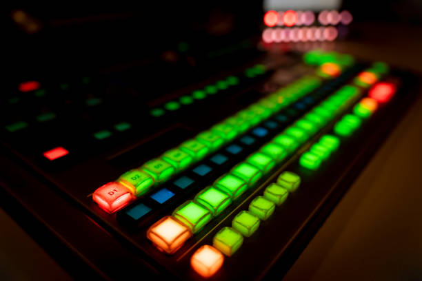 istock Blur image video switch of Television Broadcast, working with video and audio mixer, control broadcasts in recording studio. Broadcasting in the studio, professional mixing sender color buttons. 1215766485