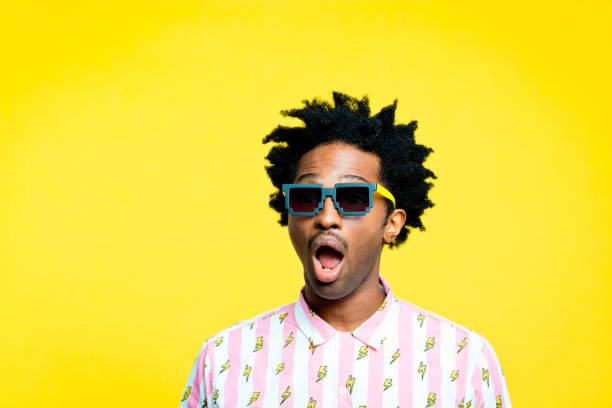 istock Surprised hipster, portrait on yellow background 1215766694