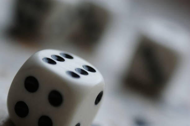 istock dice game many pieces closeup  four and six black and white 1215767269