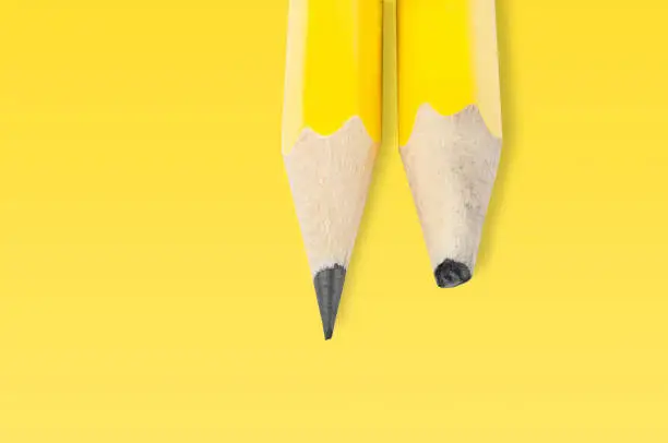 Photo of yellow pencil on yellow background