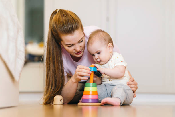 istock Baby plays with mom. What to do with your child during quarantine 1215769896