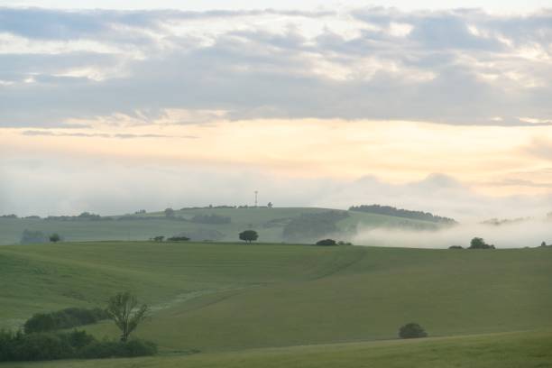 istock Sunrise or sunset over the hills and meadow. 1215769954