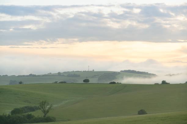 istock Sunrise or sunset over the hills and meadow. 1215769984