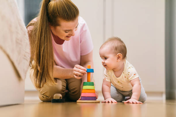 istock Baby plays with mom. What to do with your child during quarantine 1215769991