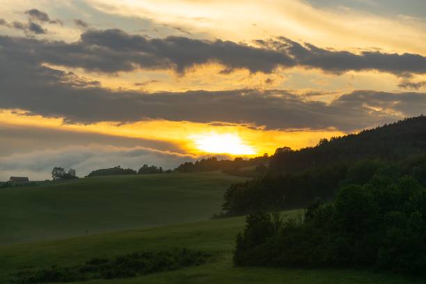 istock Sunrise or sunset over the hills and meadow. 1215770808
