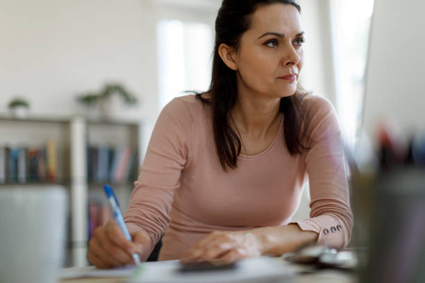 istock Mature woman working from home 1215773079