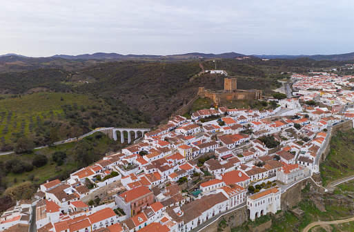 Mertola drone aerial view of the city and landscape with Guadiana river and medieval historic castle on the top in Alentejo, Portugal