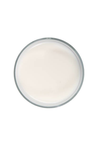 istock Milk in glass on white. Top view 1215774909