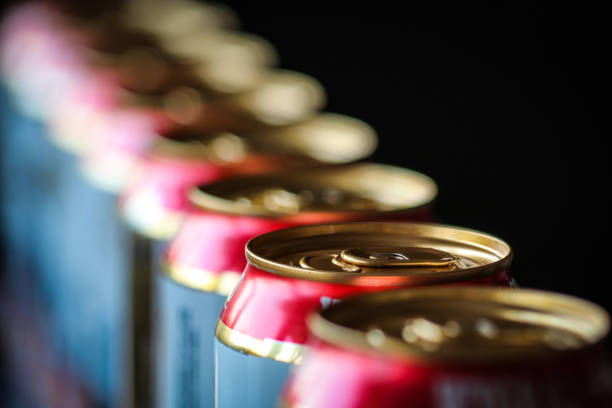istock Beer cans in a row against 1215775259