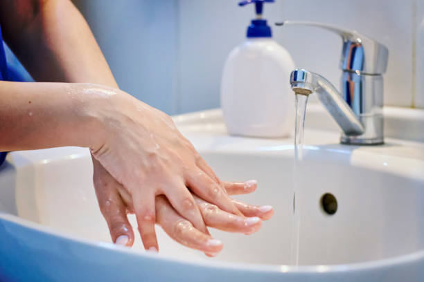 istock Woman washing hands 1215775281